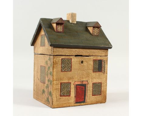 A PAINTED HOUSE STYLE TEA CADDY. 20cms high.