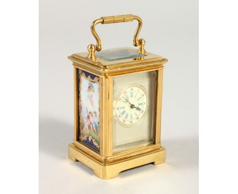 A MINIATURE FRENCH BRASS AND "SEVRES" PORCELAIN PANEL CARRIAGE TYPE CLOCK. 5.5cms high.