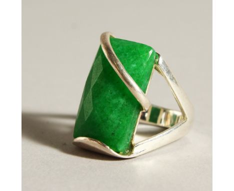 A SILVER AND JADE RING.