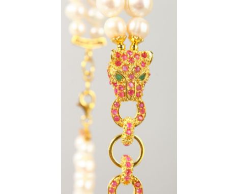 A SILVER AND GOLD PLATED RUBY SET PANTHER PEARL NECKLACE.