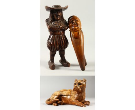 A CARVED WOOD DOG INKWELL, NUT CRACKER AND STANDING WOODEN FIGURE