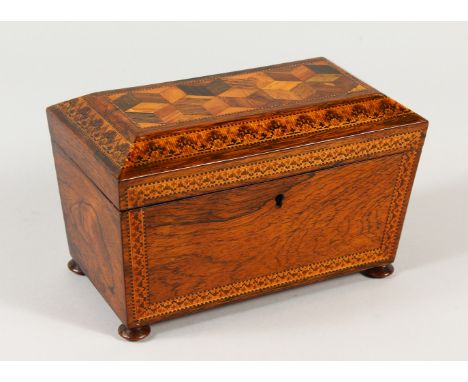 A GOOD TUNBRIDGE WARE TWO-DIVISION TEA CADDY, the top with parquetry and floral inlay, on four ball feet. 20cms long.