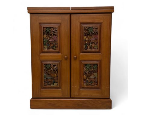 Late 20th century Asian carved teak cocktail cabinet, the folding top and double doors enclosing a fitted interior with glass