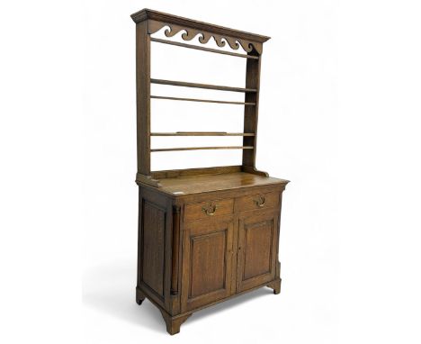 19th century and later oak dresser, moulding cornice a pierced and shaped frieze, over two open plate shelves above a base fi