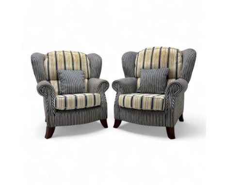 Contemporary pair of upholstered club wingback armchairs, in cream and navy vertical stripe cotton blend fabric, with wingbac