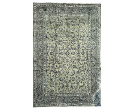Kashan Persian carpet, hand knotted and signed, ivory background with floral motifs of arabesques and palmettes with teal and