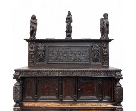 Late 17th century and later, Tridarn oak court cupboard, the top with carved and panelled panel dated 1649, above an overhang