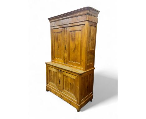 19th Century French walnut dresser, the moulded cornice over two-panelled cupboard doors, enclosing two shelves and one small