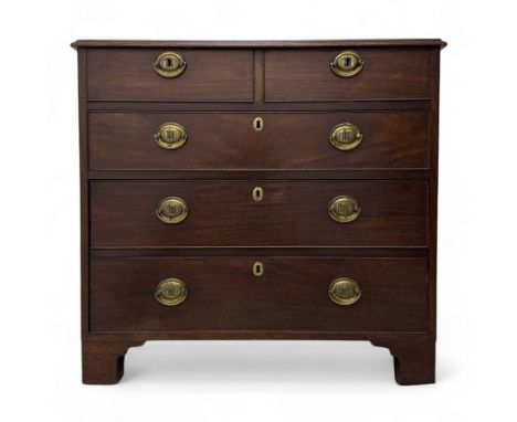 Early 19th century mahogany chest, with two short drawers over three long drawers, all cockbeaded with brass oval plate handl