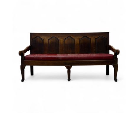 19th-century oak gothic style arched panelled bench with rounded arms, plain apron on three straight legs with pad feet and d