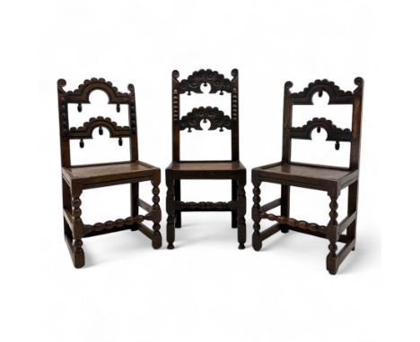 Three 19th-century Carolean style Yorkshire oak side chairs, elaborately carved crest rail and mid rail with scrolled foliate