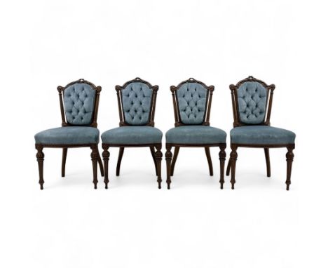 Four 19th-century walnut carved cushion-back dining chairs, button velvet upholstered shield back with carved top rail  above