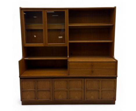 Nathan - Mid-20th century teak wall unit, upper section with glazed cupboard doors and open adjustable shelving, over a pair 