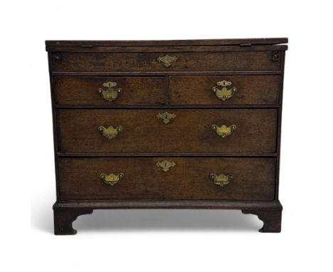 Oak bachelors chest, moulded rectangular top with brushing slide, above four cockbeaded drawers fitted with brass batwing han