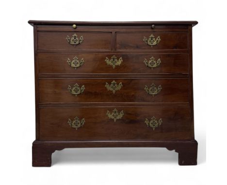 19th century mahogany bachelors chest, with moulded top and brushing slide above an arrangement of two short and three long d