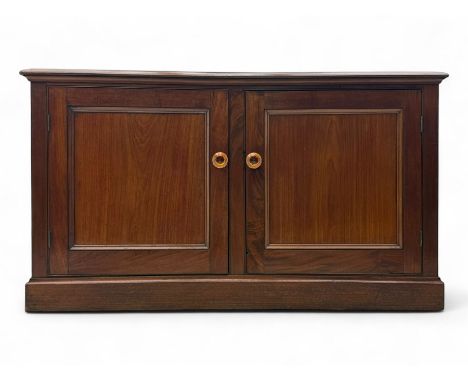 Victorian mahogany cupboard, plain rectangular top above two fielded panel doors opening to shelved interior, raised on a mou