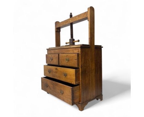 19th century oak or linen press chest, the screw press with turned handle above a rectangular top, fitted with two short over