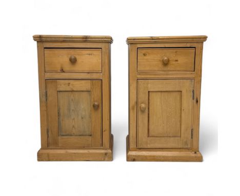 Pair of early 20th century stripped pine bedside cabinets, each with rectangular top over single drawer and panelled cupboard