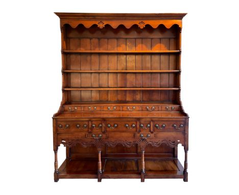 George III design cherry wood dresser, the projecting cornice over shaped frieze with pierced shell decoration, fitted with t