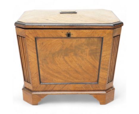 Early 19th century mahogany cellarette, tapering canted rectangular form, the hinged faceted top enclosing fitted interior, p