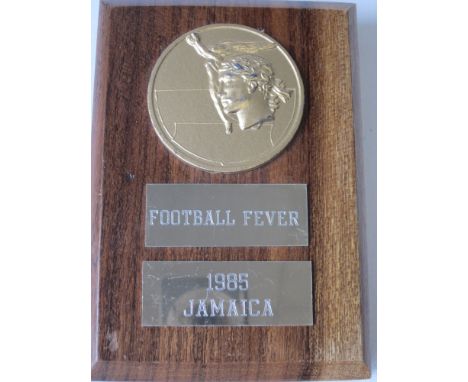 MANCHESTER UTD    A wooden plaque inscribed "Football Fever" from the Caribean Tour after the post season Friendly against a 