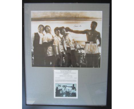 CASSIUS CLAY AUTOGRAPH / MUHAMMAD ALI / THE BEATLES      A 32" X 20" framed and glazed item of the 19" X 15" photograph of Al