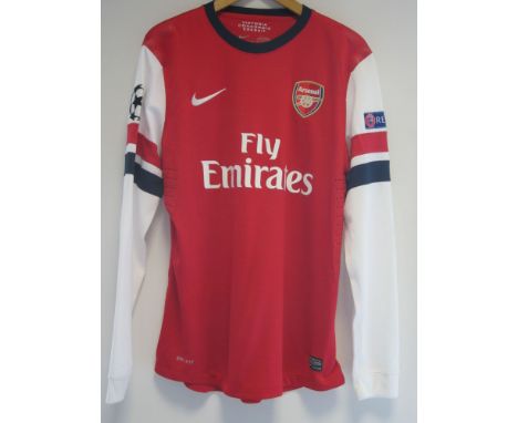 KIERAN GIBBS ARSENAL MATCH WORN SHIRT     A red with white long sleeves shirt with Gibbs 28 on the back an Champions League a