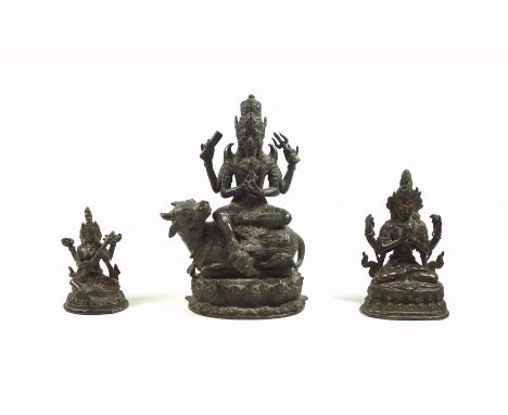18th Century Tibetan bronze figure of the bodhisattva Chaturbhuja Lokesvara, seated in Vajrasana on a double lotus throne, on