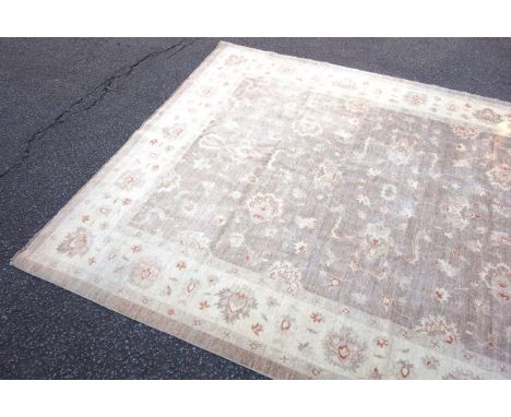 Large Persian carpet, the camel coloured field with all-over palmette decoration, within a similar ivory border and guards, 4