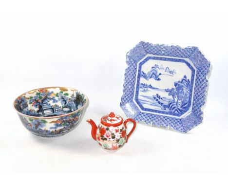 Japanese Edo Period Imari porcelain bowl, decorated in underglaze blue with coastal scenes, and highlighted in overglaze red,