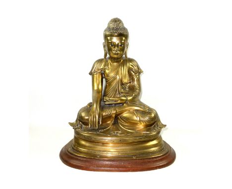 Large Burmese gilt bronze figure of Buddha, Mandalay Period, 19th Century, wearing a pleated Sanghati and seated in Vajrasana