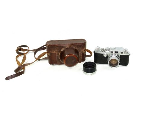 Leica IIIf Red Dial camera, 1953, serial number 666680, with a Summicron 5cm F2 lens, (scratches), and an Elmar lens hood, ca