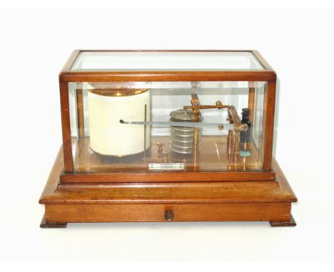 Barograph by Chadburns Ltd., Opticians, Liverpool, in a mahogany and bevelled glazed case, with a chart drawer below, 22 x 36