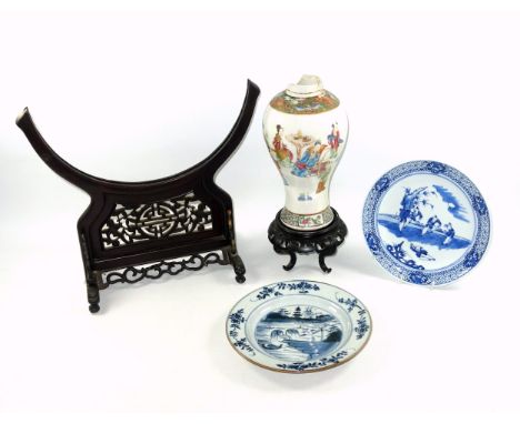 18th Century Chinese porcelain plate, decorated in underglaze blue with figures playing in a garden, within a stylised bat an