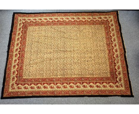 Large Eastern batik panel, the cream field with all-over floral decoration, within a red elephant border, and multiple other 