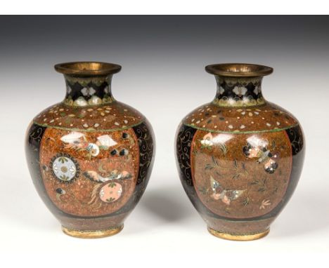 A pair of black ground Japanese cloisonn&eacute; vases Meiji period, of squat baluster form, with fine brass wire foliate dec