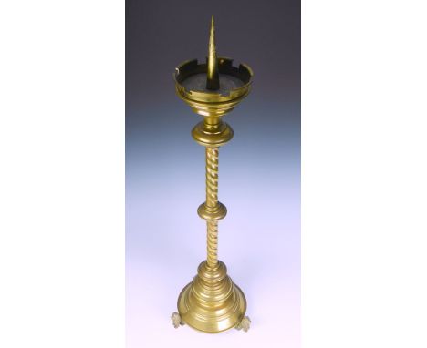 An impressive brass altar pricket candle stick late 19th century, elongated brass conical pricket housed within a turret form