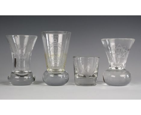 Four drinking glasses of Masonic interest two of campana form on heavy glass bun feet, one for the Hampshire and Isle of Wigh