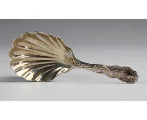 A late-Victorian silver caddy spoon Josiah Williams &amp; Co., London 1900, with fancy foliate and scroll handle and shell bo