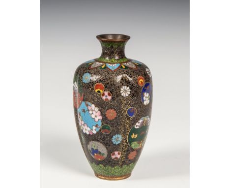 A small black ground Japanese cloisonn&eacute; vase Meiji period, of tapered, four-lobed form, with brass wire C-scrolls on a