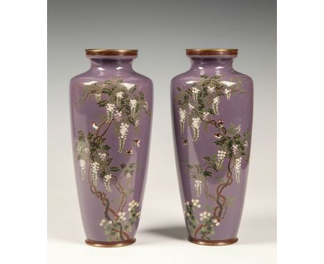 A pair of Japanese cloisonn&eacute; silver wired purple ground vases Meiji period, of slender, tapering form, decorated withi