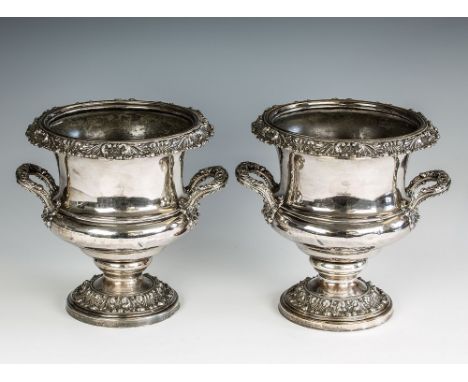 A pair of early 19th century Old Sheffield Plate wine coolers of twin handled urn form, with foliate and beaded borders and f