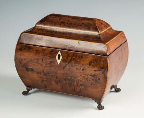 A good Georgian burr yew wood tea caddy bombe form, box wood strung domed hinged lid bearing two diamond motifs with canted s