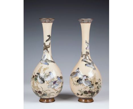 A pair of Japanese cloisonn&eacute; silver wired long necked bottle vases the tapered bodies with fine silver wire depicting 