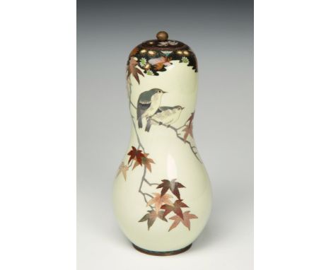 An unusual gourd shaped Japanese cloisonn&eacute; covered vase Meiji period, the pale yellow ground decorated in fine silver 