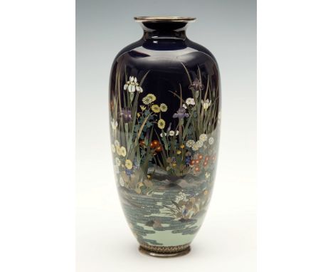 A silver wired dark blue ground Japanese cloisonn&eacute; vase Meiji period, of slender form with short everted neck, decorat