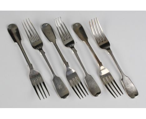 A matched set of six Victorian silver fiddle pattern dessert forks three by Henry Holland, London 1856; and three by Goldsmit