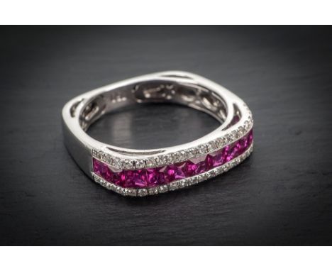 An 18ct white gold, ruby and diamond eternity ring the squared section ring channel set with eleven princess cut rubies, tota