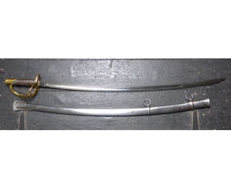 A model 1862 cavalry sabre standard features include wooden handle with a swell covered with leather and a wire grip, brass h