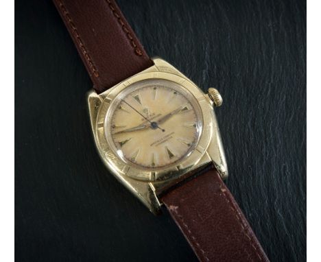 A gentlemen's Rolex yellow gold bubble back wrist watch 1940s, tests as 14ct gold, the 23mm. matt gold dial with gold sword b